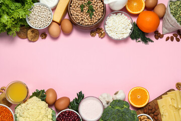 Food high in calcium. Flat lay composition with different products on pink background ,space for text