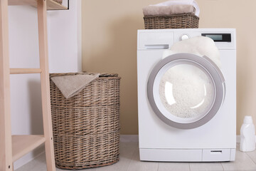Foam coming out from broken washing machine during laundering in room