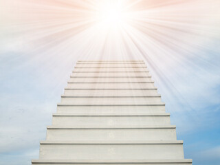 A white staircase stretches up the horizon. That means to be success or go to heaven.