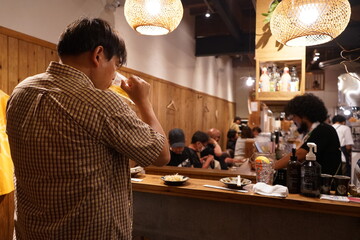 Izakaya or Bar in Japan, Man drinking at Japanese Pub - 日本 立ち飲み 居酒屋...