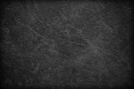 Dark grey black slate background or texture. © peekeedee