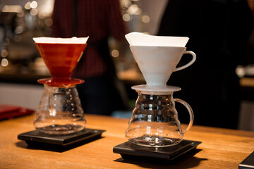 brewing coffee using chemex alternative method, two coffee funnels stand on scales and brew hot drinks, coffee filter