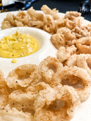 Delicious plate of fried calamari on a plate in a restaurant