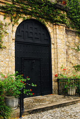 Fototapeta na wymiar Front Door, of the Plymouth Congregational Church is surrounded by a coral wall