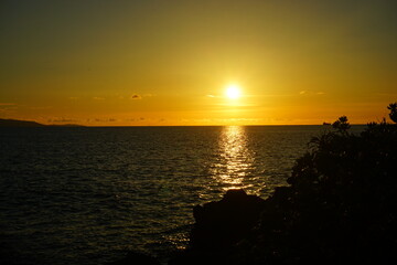 Obraz premium Beautiful Sun down, Sunset at Beach in Ishigaki-jima Island, Okinawa, Japan - 日本 沖縄 石垣島 琉球観音埼灯台 海 夕日