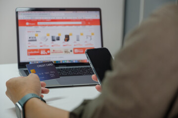Man using smart phone and holding credit card with online shopping.Online payment concept. payment...