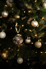 christmas tree with decorations ball and ultrasound picture in it
