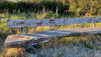 old bench in abandoned parking lot