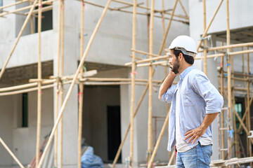Fototapeta na wymiar Single Foreman talking by mobile phone with vendor material construction site
