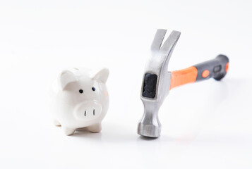 piggy bank with hammer and nails