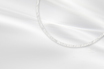 風になびく白ドレープ生地に、とクリスタルの装飾。ウエディングやコスメの背景。