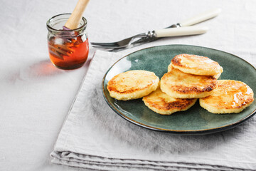 Cottage cheese pancakes with honey.