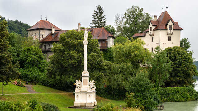 WERNSTEIN AM INN, GERMANY - JULY 12, 2019:   View of the Medieval Burg Wernstein castle and Marian Column (Mariensaule).