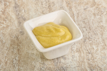 Organic mustard sauce in the bowl