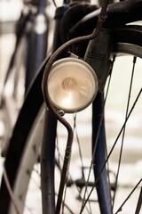 Fototapeta na wymiar Old vintage bicycle front lamp on natural light background.