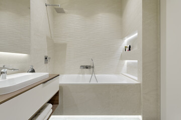 bathroom with beige tiles with stone texture, modern bathroom interior