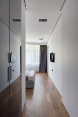 bedroom, bedroom entrance with TV and large window, modern city apartment