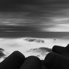 Dramatic long exposure shot of sea rocks waves and cloudy sky, Kanagawa Prefecture, Japan - obrazy, fototapety, plakaty