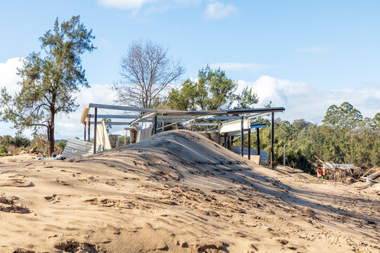 Photograph of a severely flood damaged building on the banks of the Hawkesbury river