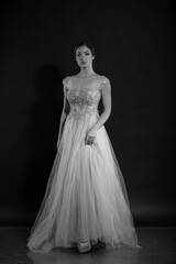 Portrait of woman in vintage dress in black and white