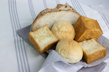 Mixed Bread in a basket on white background