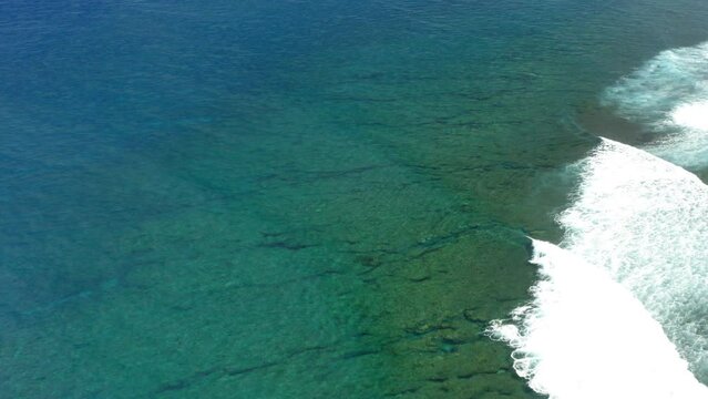 Aerial Panning Beautiful View Of Wavy Ocean On Sunny Day - Suva, Fiji