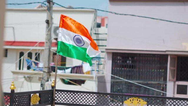 India flag. Indian flag displaying on a pole in front of the house. Tricolor flag waving in Indian home in celebration of Independence day at Bhuj, Kutch, India