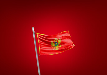Montenegro flag waving in the wind on flagpole. - obrazy, fototapety, plakaty