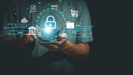 Businessman is using smartphone to protect personal information, virtual lock screen icon is available on online network, financial security, marketing and internet traffic concept