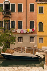 Fototapeta na wymiar colorful laundry hung to dry outside of a building in Venice, Italy