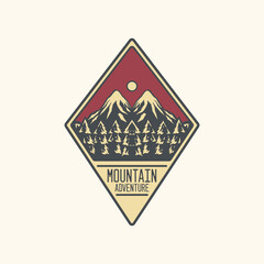 Diamond shaped emblem of pine forest mountain