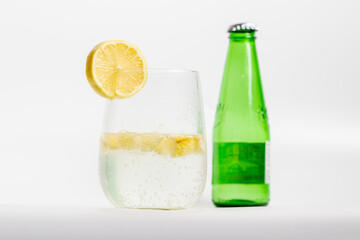 mineral water bottle and mineral water with lemon