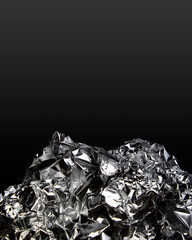 crumpled foil on black background
