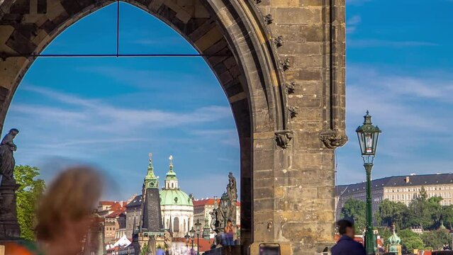 Old Town Bridge Tower arch of the Charles Bridge timelapse - one of the most beautiful Gothic constructions in world. It was designed by Peter Parler at end of 14th century. Prague, Czech Republic.