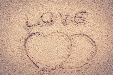 heart drawn in sand