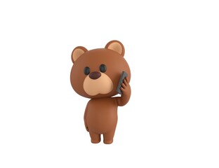 Obraz premium Little Bear character holding smartphone near ear in 3d rendering.