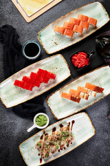 different rolls on beautiful plates with napkins top view composition