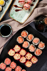 different rolls on beautiful plates with napkins top view composition