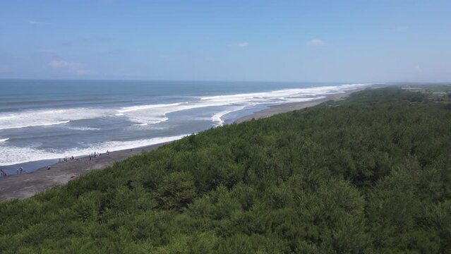 Aerial view of people holiday in parangtritis beach, Indonesia