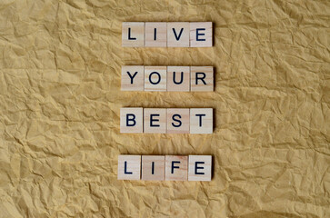 live your best life text on wooden square, inspiration and motivation quotes