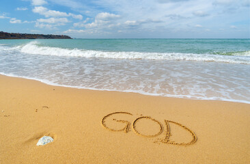 God word on the sea shore.