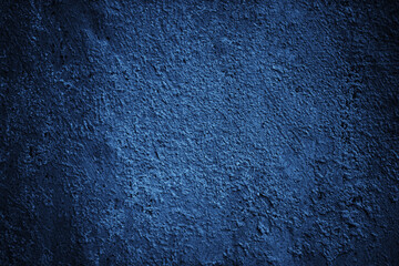 Dark blue texture. Toned rough wall surface. Background for design. Close-up.