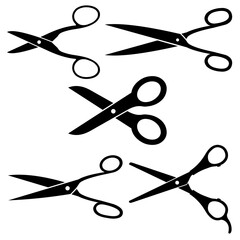 Different pairs of scissors on white background