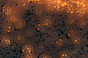 Abstract golden background. Colored soap foam texture. Gel foam with bubbles