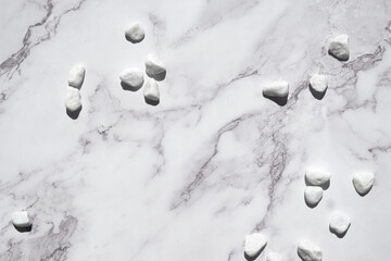 Natural stone marble background with white stones. Off white natural minimal organic zen backdrop....