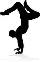 Obraz na płótnie Canvas A male street dance hip hop dancer in silhouette