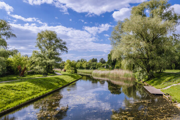 Fototapeta na wymiar Water canal in Kepa Potocka park in Warsaw city, Poland