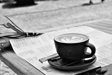 Cup of coffee and bag on the table