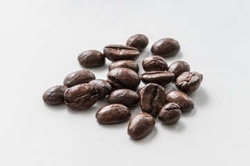 Coffee beans macro close-up, white background