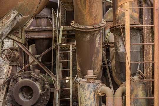 Heavy Industry Background Many Pipes And Ladders Made Of Rusty Iron